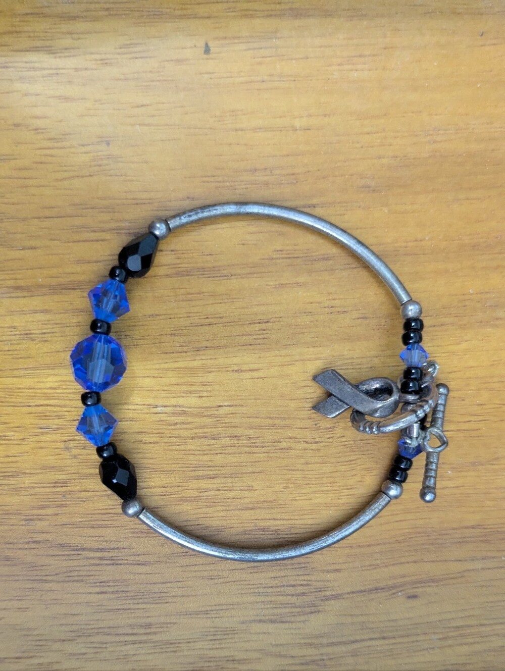 Child Abuse Prevention Bracelet with Blue and Black Beads and Ribbon Charm